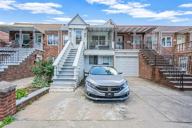 a front view of a house with a garden and outdoor seating