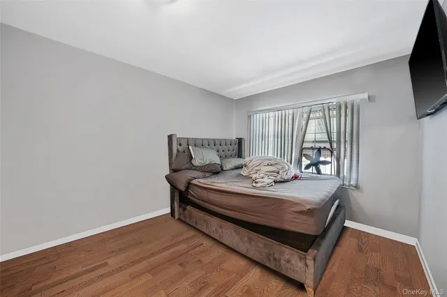 a bedroom with a bed and with closet