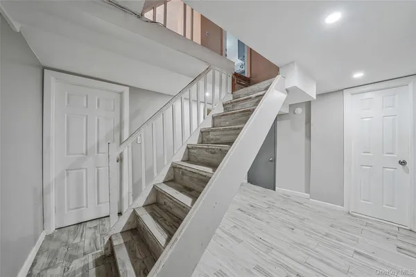 a room with furniture and wooden floor