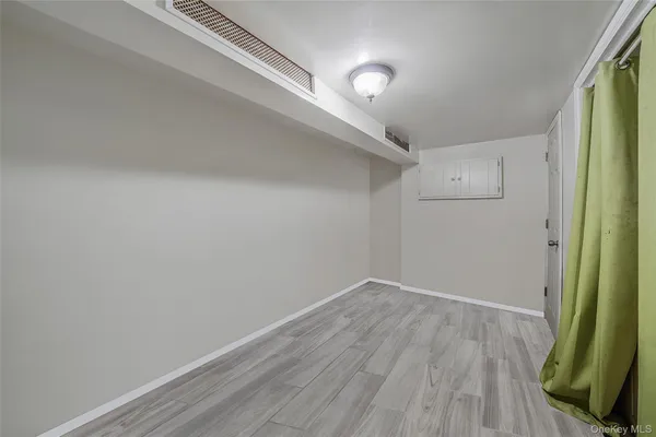 a white toilet sitting next to a white sink