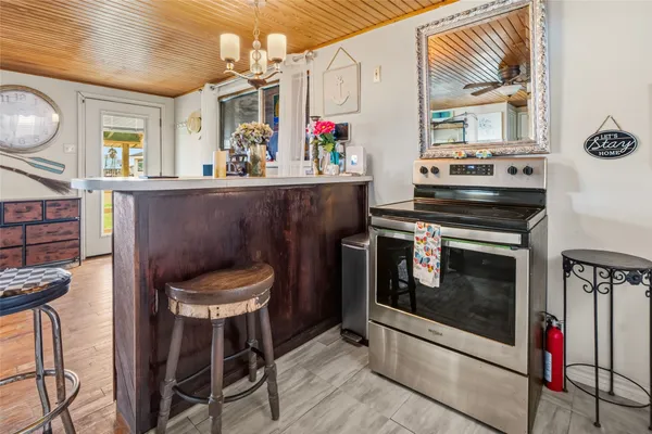 a kitchen with a stove and a refrigerator