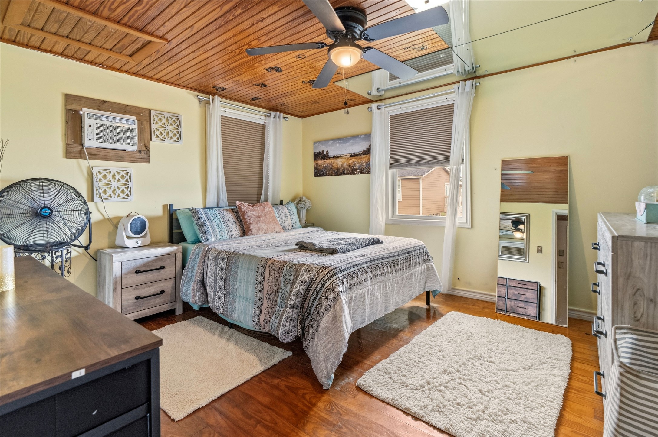 512 Caisson Street Surfside Beach, TX 77541 - Photo 14 of 29 a bedroom with a bed and wooden floor