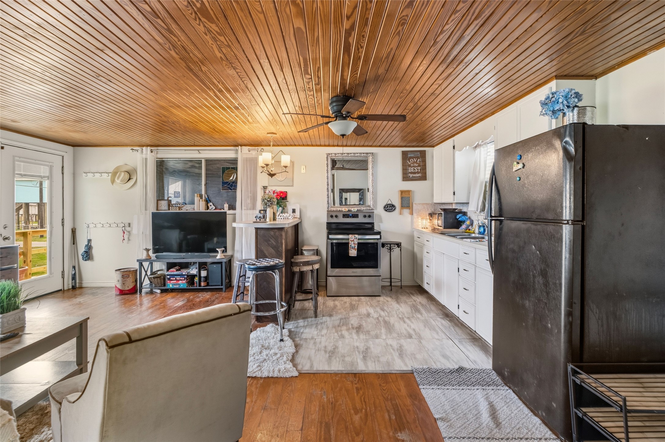 512 Caisson Street Surfside Beach, TX 77541 - Photo 15 of 29 a kitchen with stainless steel appliances granite countertop a sink refrigerator and cabinets