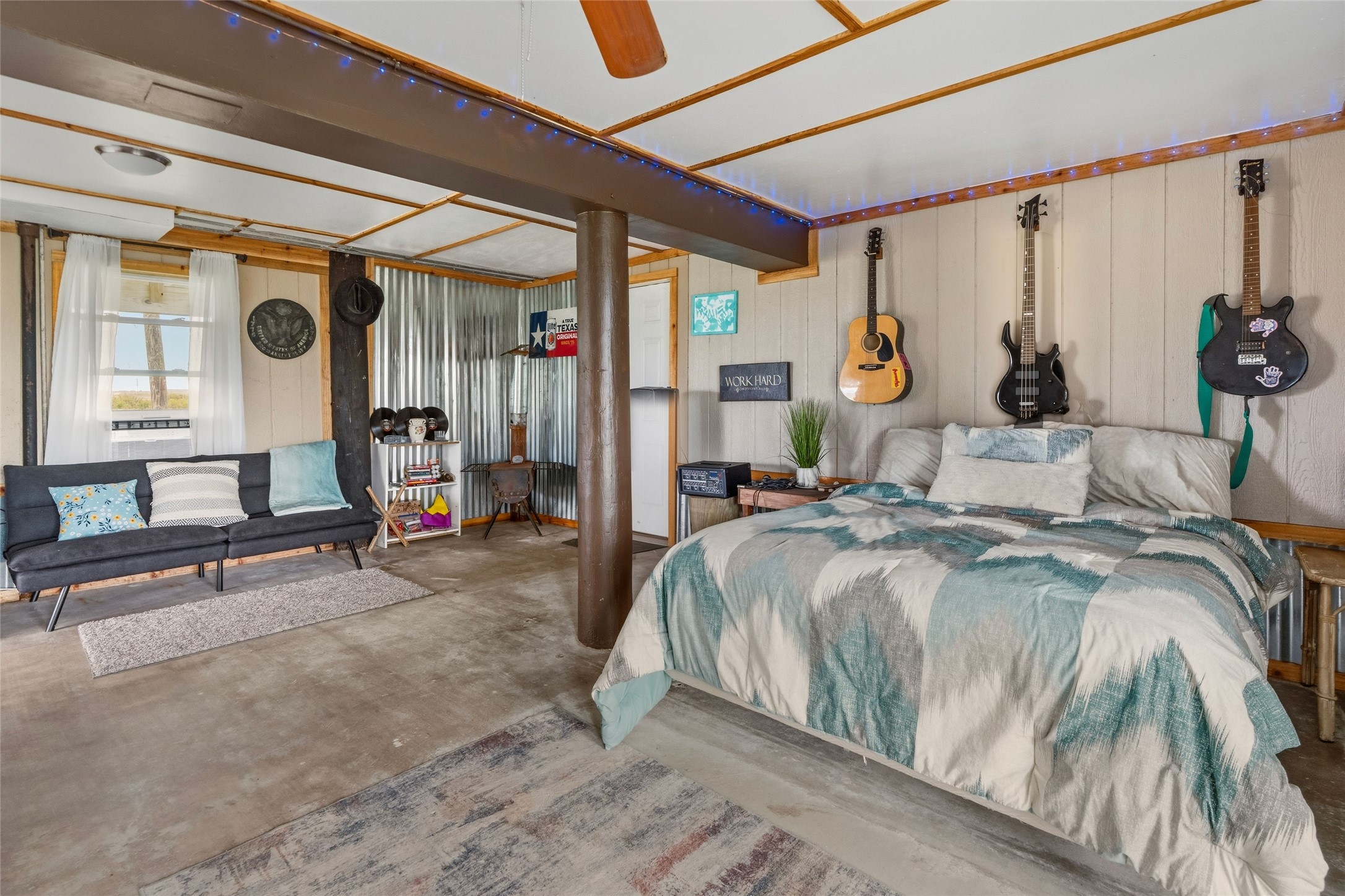 512 Caisson Street Surfside Beach, TX 77541 - Photo 19 of 29 a bedroom with a large bed and a large window