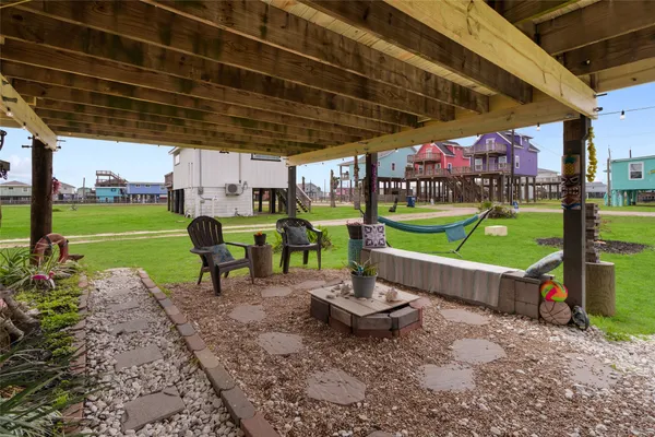 a view of a chairs and table in patio