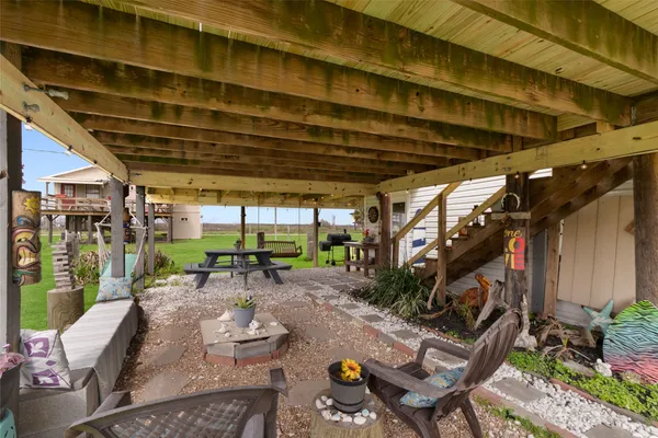 a view of a big house with a big yard and large trees