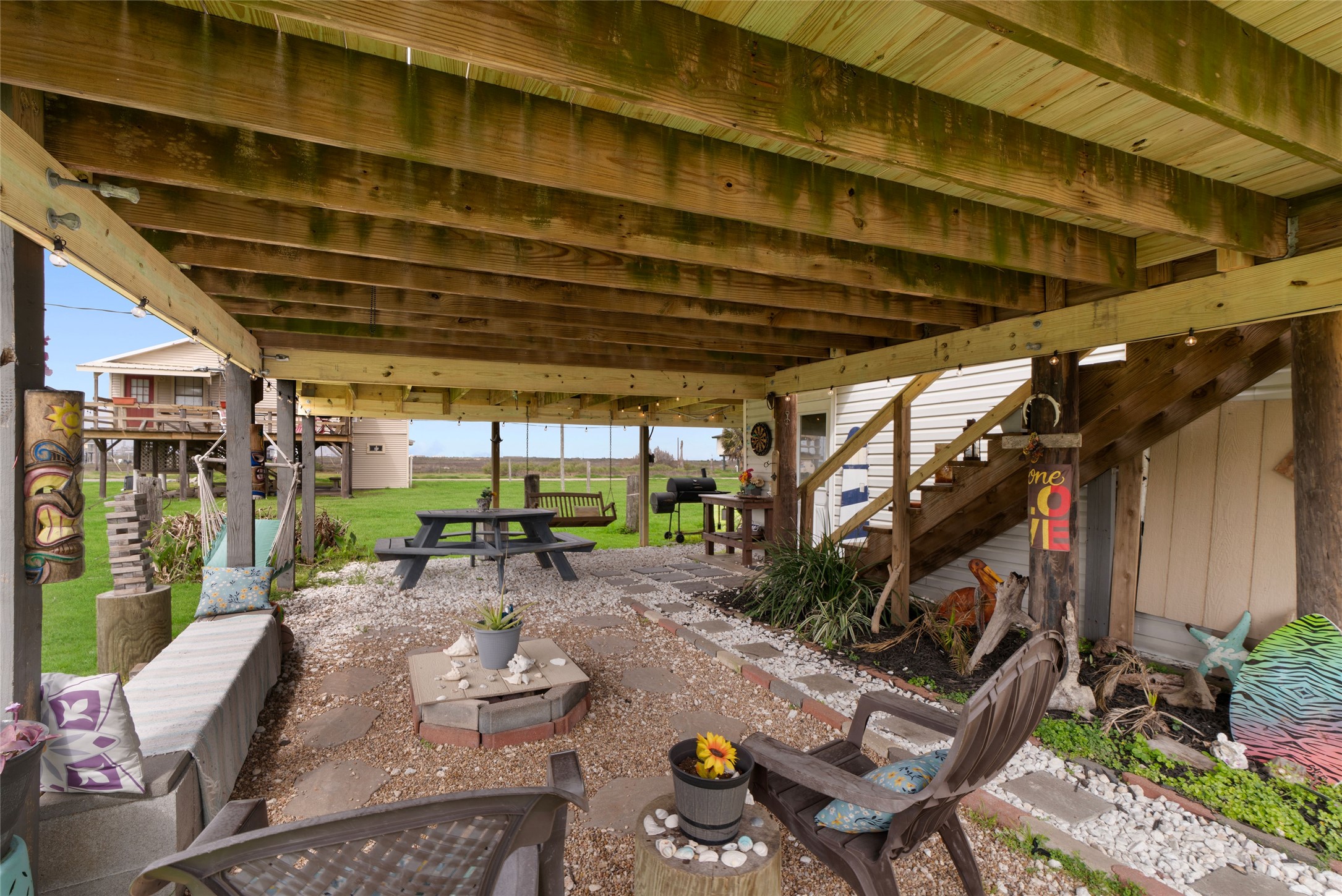 512 Caisson Street Surfside Beach, TX 77541 - Photo 25 of 29 a view of a chairs and table in patio