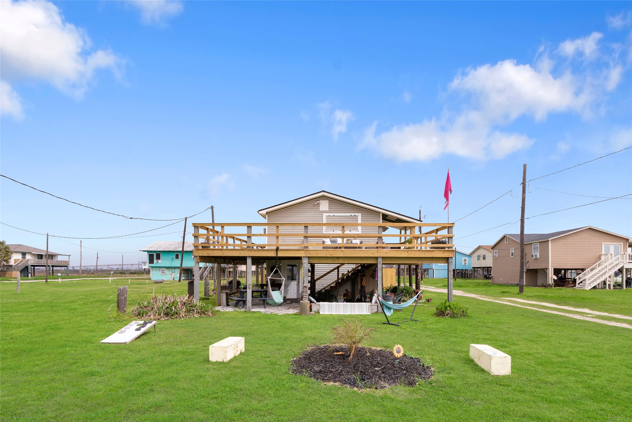 512 Caisson Street Surfside Beach, TX 77541 - Photo 27 of 29 a view of a big house with a big yard and large trees