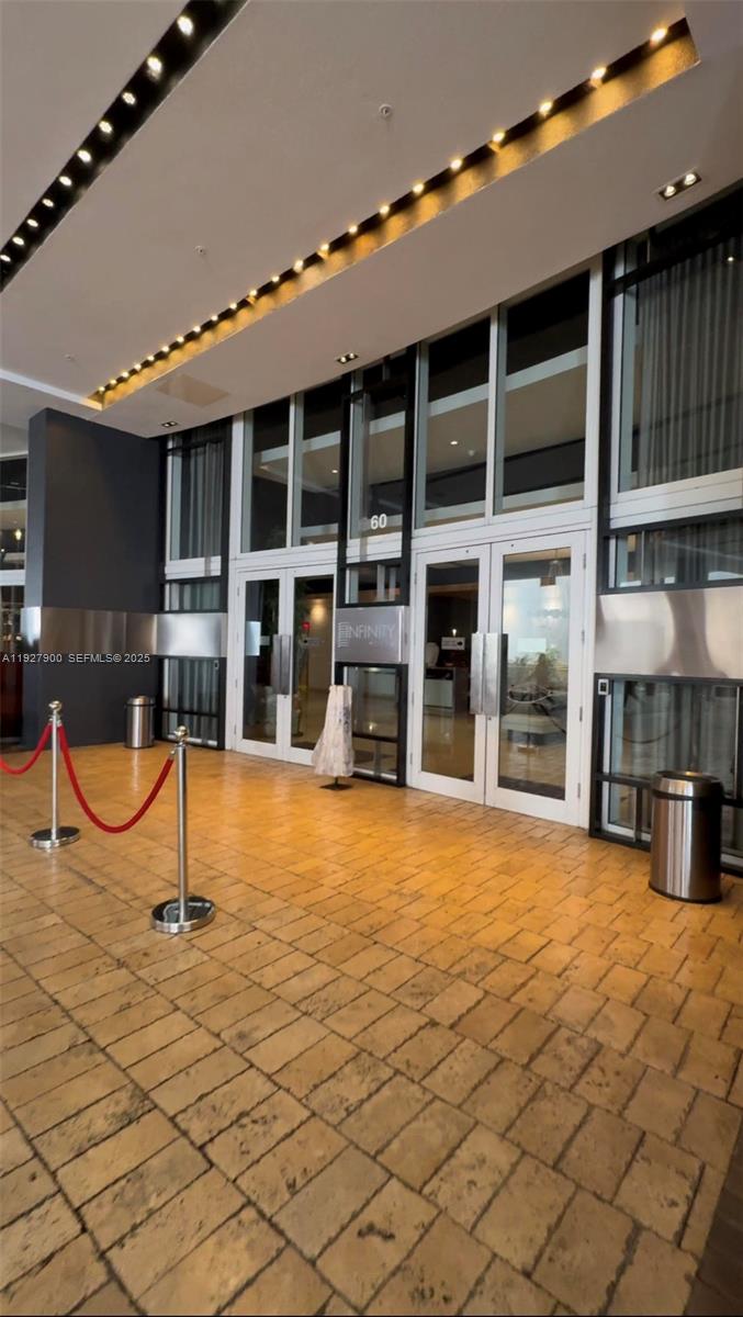 60 Southwest 13th Street, Unit 1219 Miami, FL 33130 - Photo 15 of 15 a swimming pool with a bench and tables