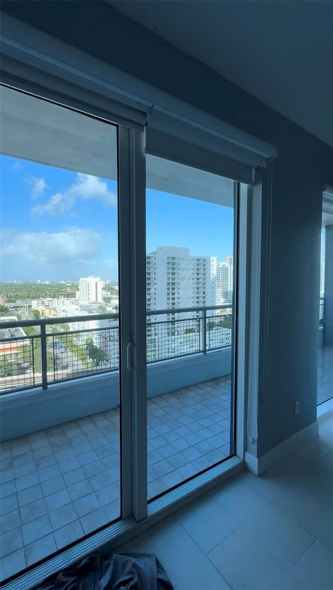 60 Southwest 13th Street, Unit 1219 Miami, FL 33130 - Photo 3 of 15 a view of a glass door and the balcony