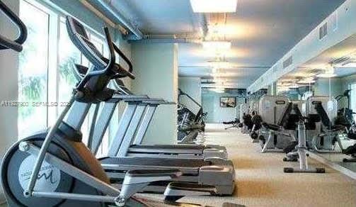 60 Southwest 13th Street, Unit 1219 Miami, FL 33130 - Photo 10 of 15 a view of a room with gym equipment