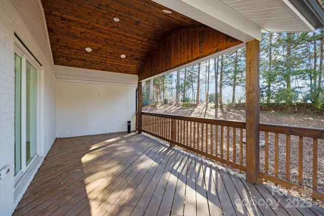 a view of a porch with wooden floor