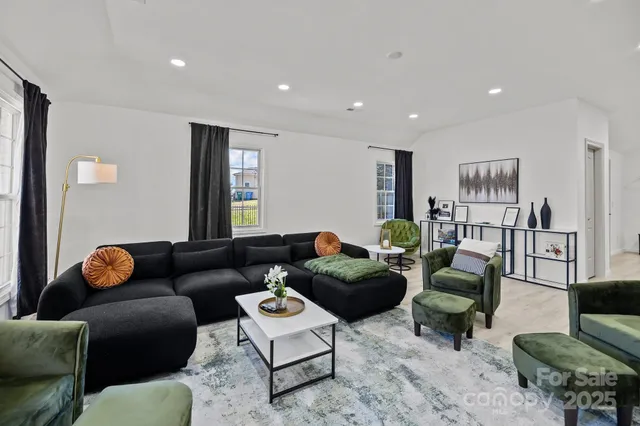 a living room with furniture and a table