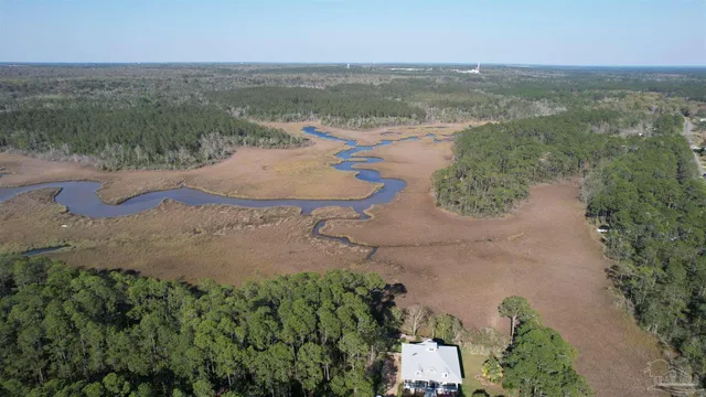 an aerial view of a houses with outdoor space