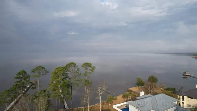 a bathroom with a sink mirror and vanity