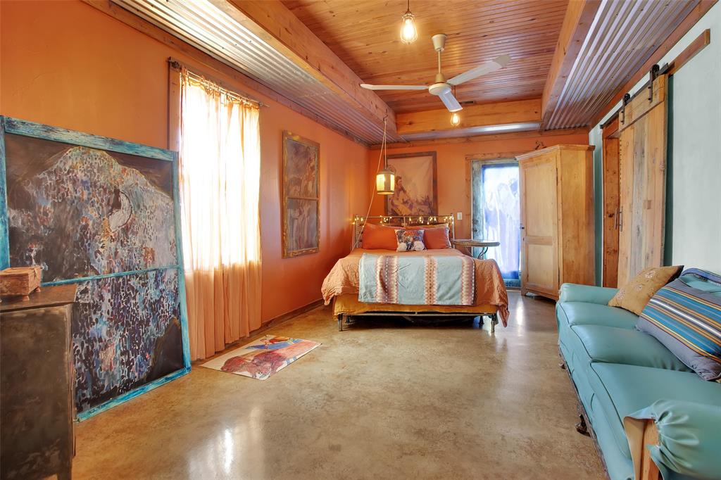 855 Buck Creek Road Tioga, TX 76271 - Photo 13 of 27 a bed room with a bed and a couch