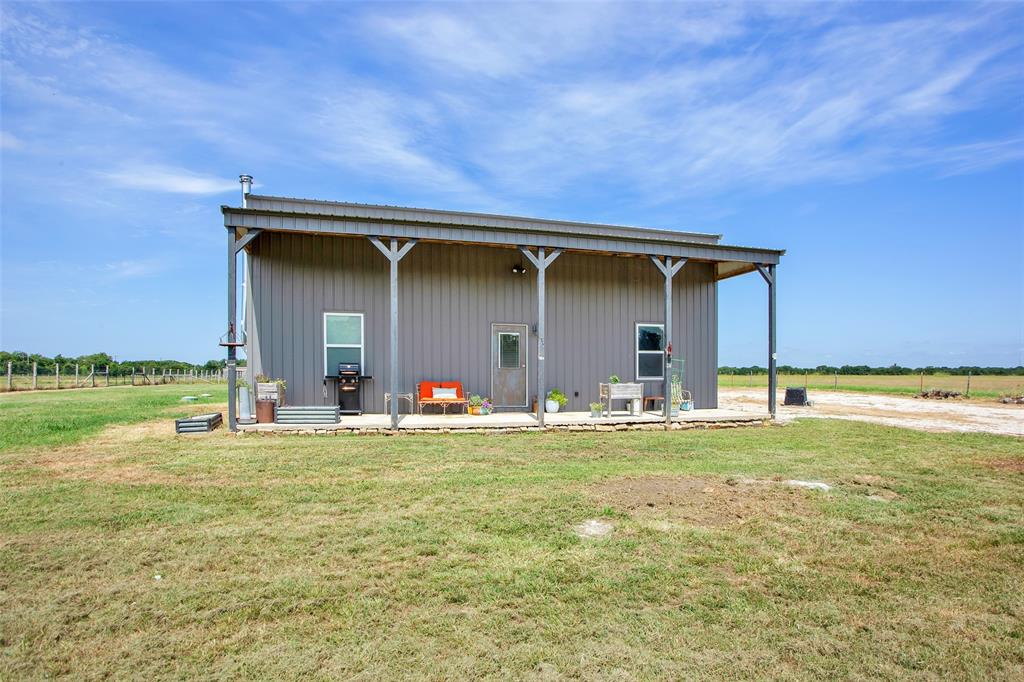 855 Buck Creek Road Tioga, TX 76271 - Photo 25 of 27 a view of a house with backyard and porch
