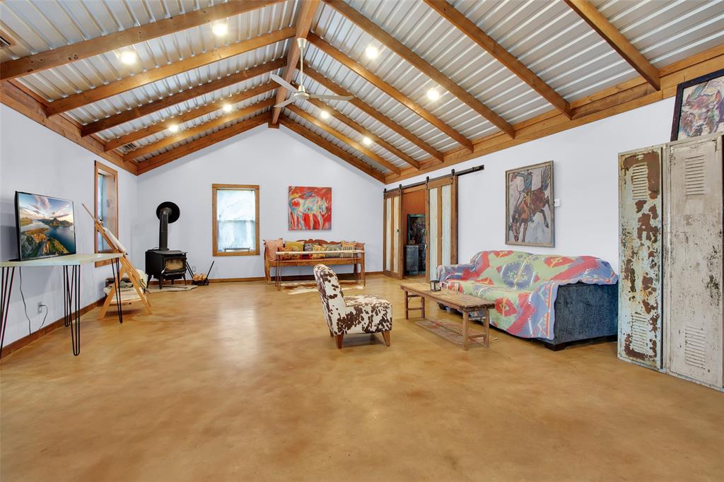 855 Buck Creek Road Tioga, TX 76271 - Photo 8 of 27 a living room with furniture and a chandelier