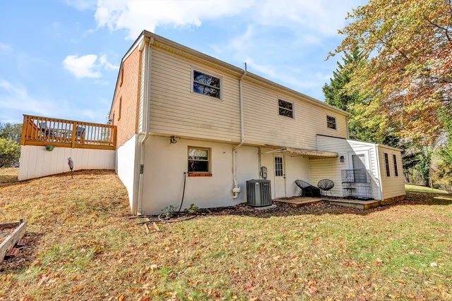 a backyard of a house with large trees