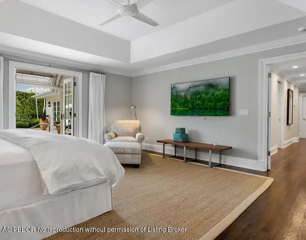 a bathroom with a granite countertop sink mirror and a bathtub