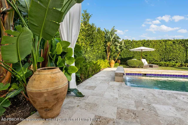 a living room filled with furniture and a garden