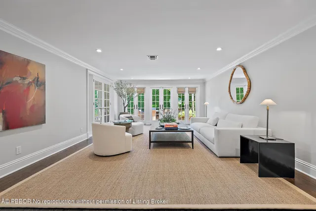 a kitchen with granite countertop white cabinets and a stove