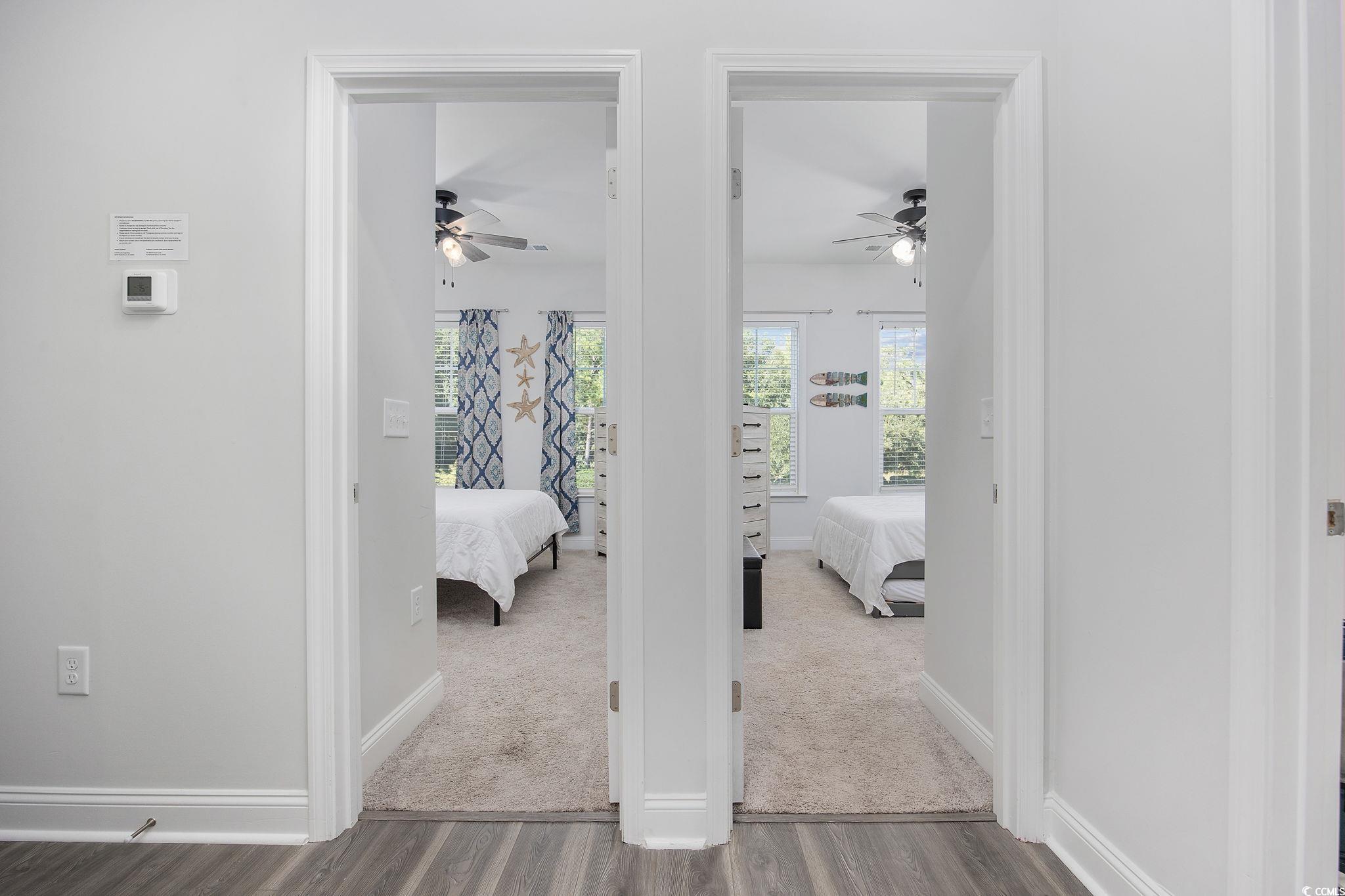 5130 Double Eagle Way North Myrtle Beach, SC 29582 - Photo 32 of 39 Carpeted bedroom with baseboards and wood finished floors