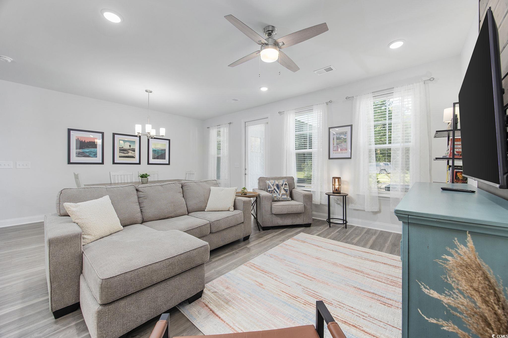 5130 Double Eagle Way North Myrtle Beach, SC 29582 - Photo 6 of 39 Living area with light wood-style floors, a chandelier, ceiling fan, and recessed lighting