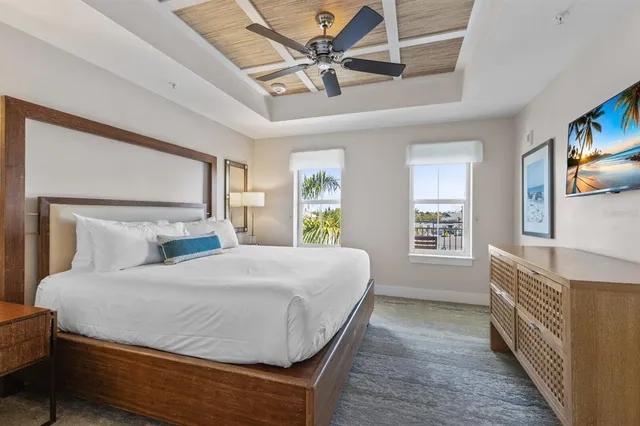 a bedroom with a bed dresser and a window