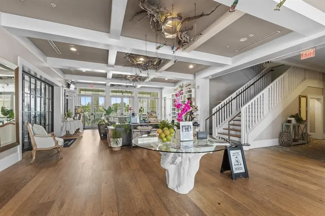 a view of a dining room with furniture and wooden floor