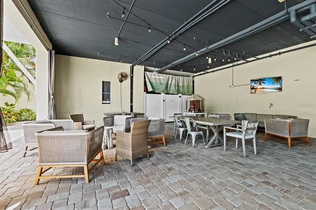 a view of a lake with a table and chairs