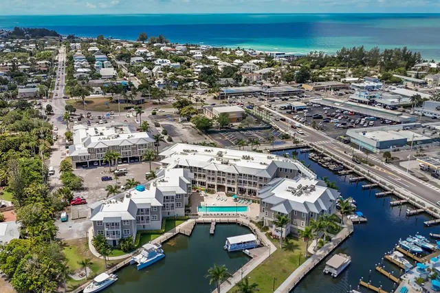 an aerial view of a house with a ocean view