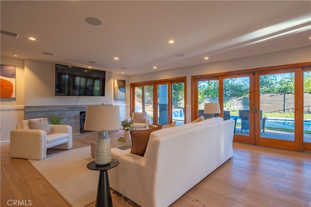 556 Camillo Road Sierra Madre, CA 91024 - Photo 17 of 52 a living room with couches and a flat screen tv
