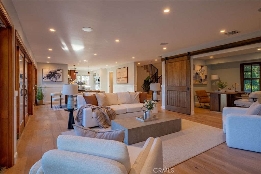 556 Camillo Road Sierra Madre, CA 91024 - Photo 20 of 52 a living room with furniture kitchen view and a large window