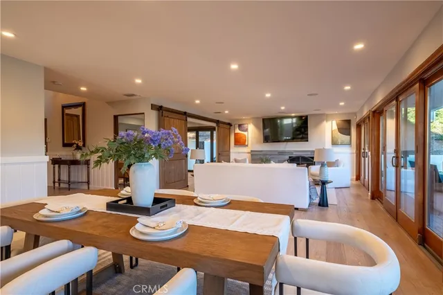 a view of a dining room with furniture and a potted plant