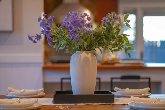 a vase of flowers sitting on a table