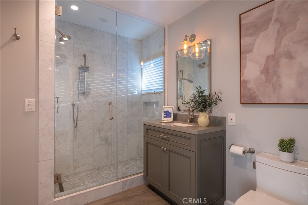 556 Camillo Road Sierra Madre, CA 91024 - Photo 35 of 52 a bathroom with a granite countertop sink a toilet and shower