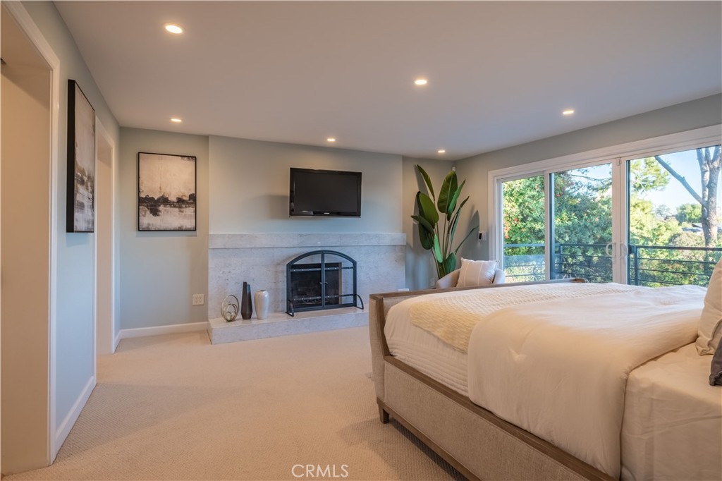 556 Camillo Road Sierra Madre, CA 91024 - Photo 40 of 52 a bedroom with a bed and a flat screen tv