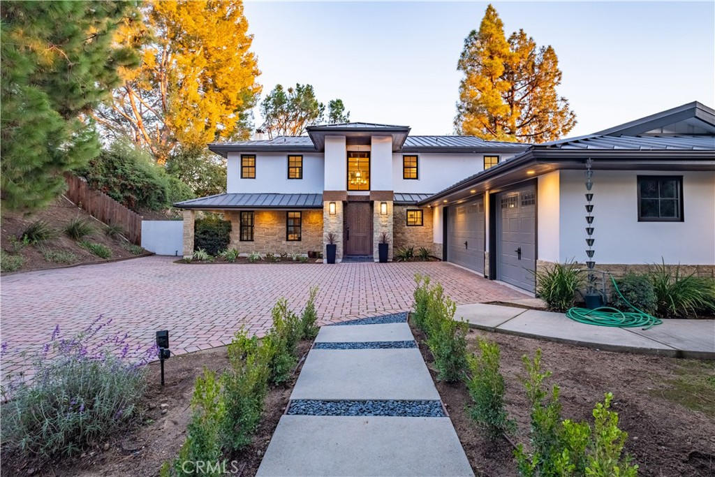556 Camillo Road Sierra Madre, CA 91024 - Photo 4 of 52 a front view of a house with a yard and potted plants