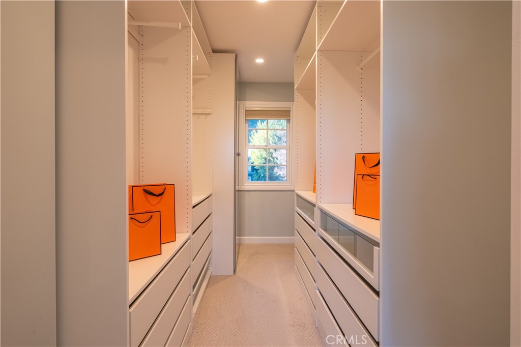 556 Camillo Road Sierra Madre, CA 91024 - Photo 47 of 52 a view of a hallway with wooden floor and a bathroom