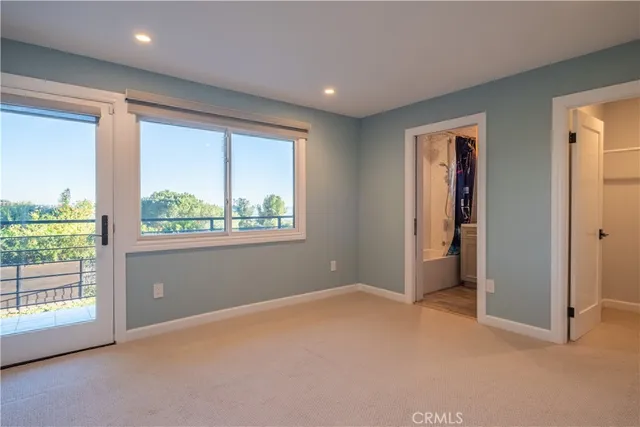 a spacious bathroom with a double vanity sink a mirror and a shower