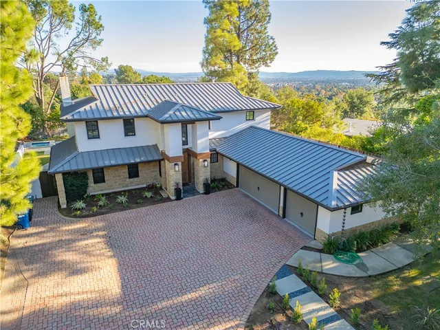 a view of a house with a yard and balcony