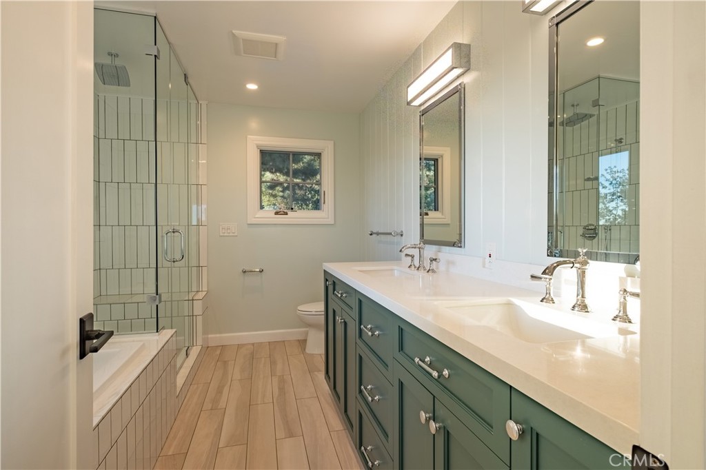 556 Camillo Road Sierra Madre, CA 91024 - Photo 51 of 52 a spacious bathroom with a double vanity sink a mirror and a shower