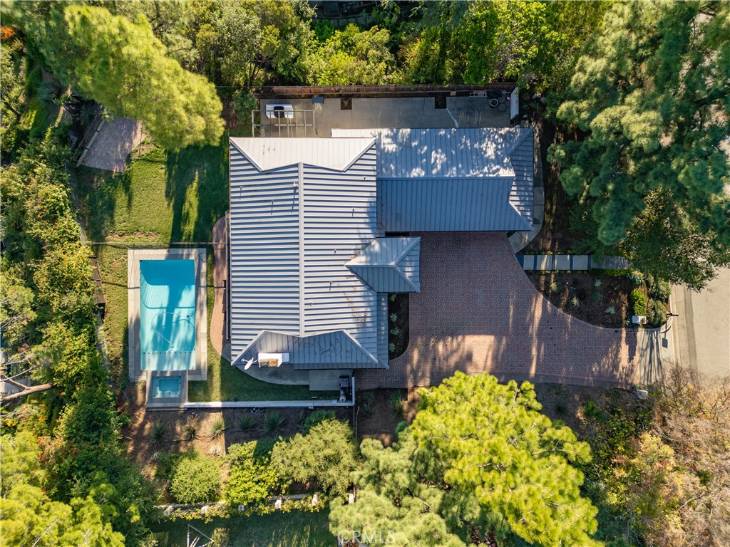 556 Camillo Road Sierra Madre, CA 91024 - Photo 6 of 52 a front view of a house with a yard and a garden