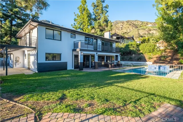 a view of house with a yard