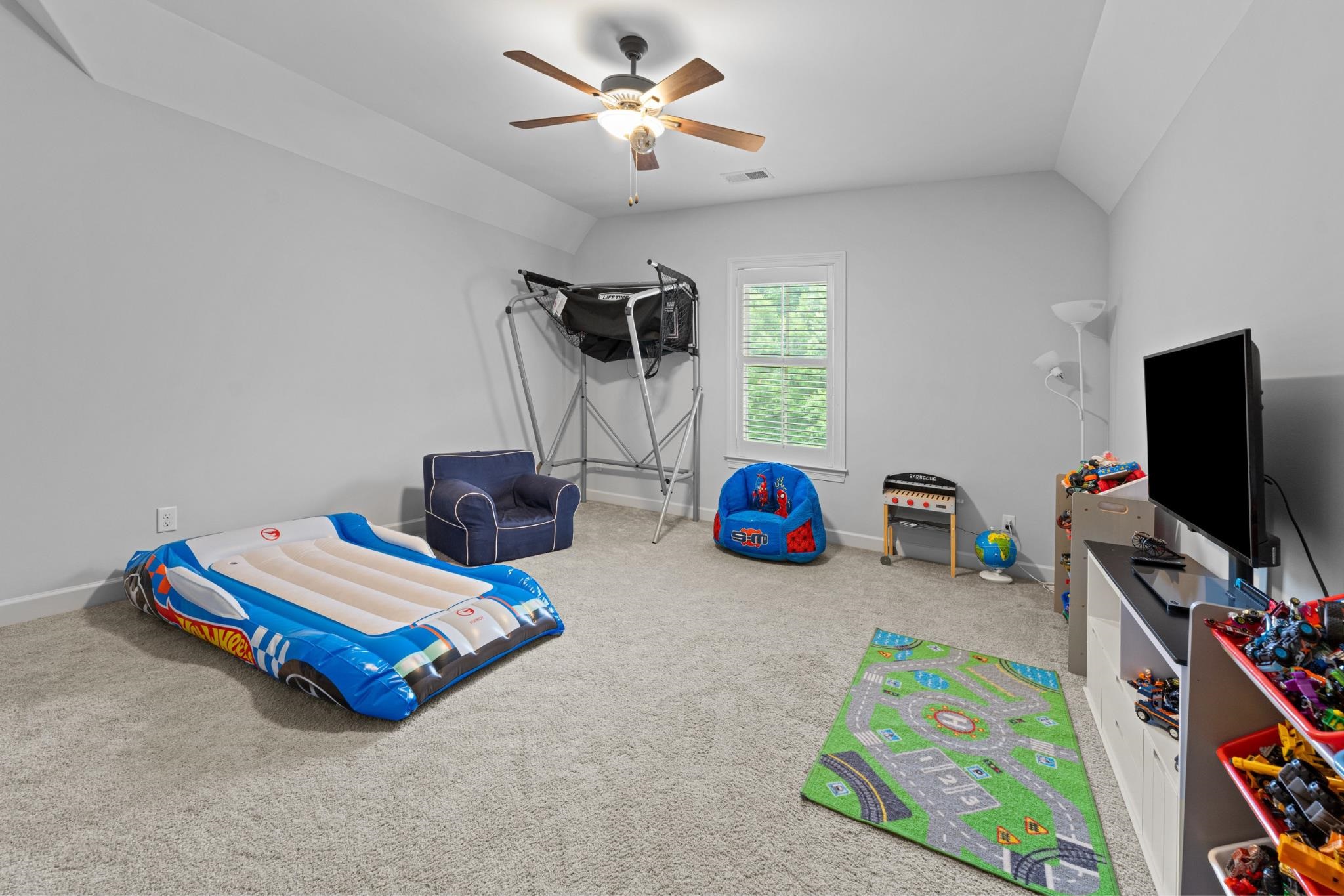 10354 Pleasant Ridge Road Arlington, TN 38002 - Photo 25 of 40 Versatile oversized fourth bedroom offering plenty of space for a playroom, or guest retreat with soft carpet, neutral tones, and bath access.