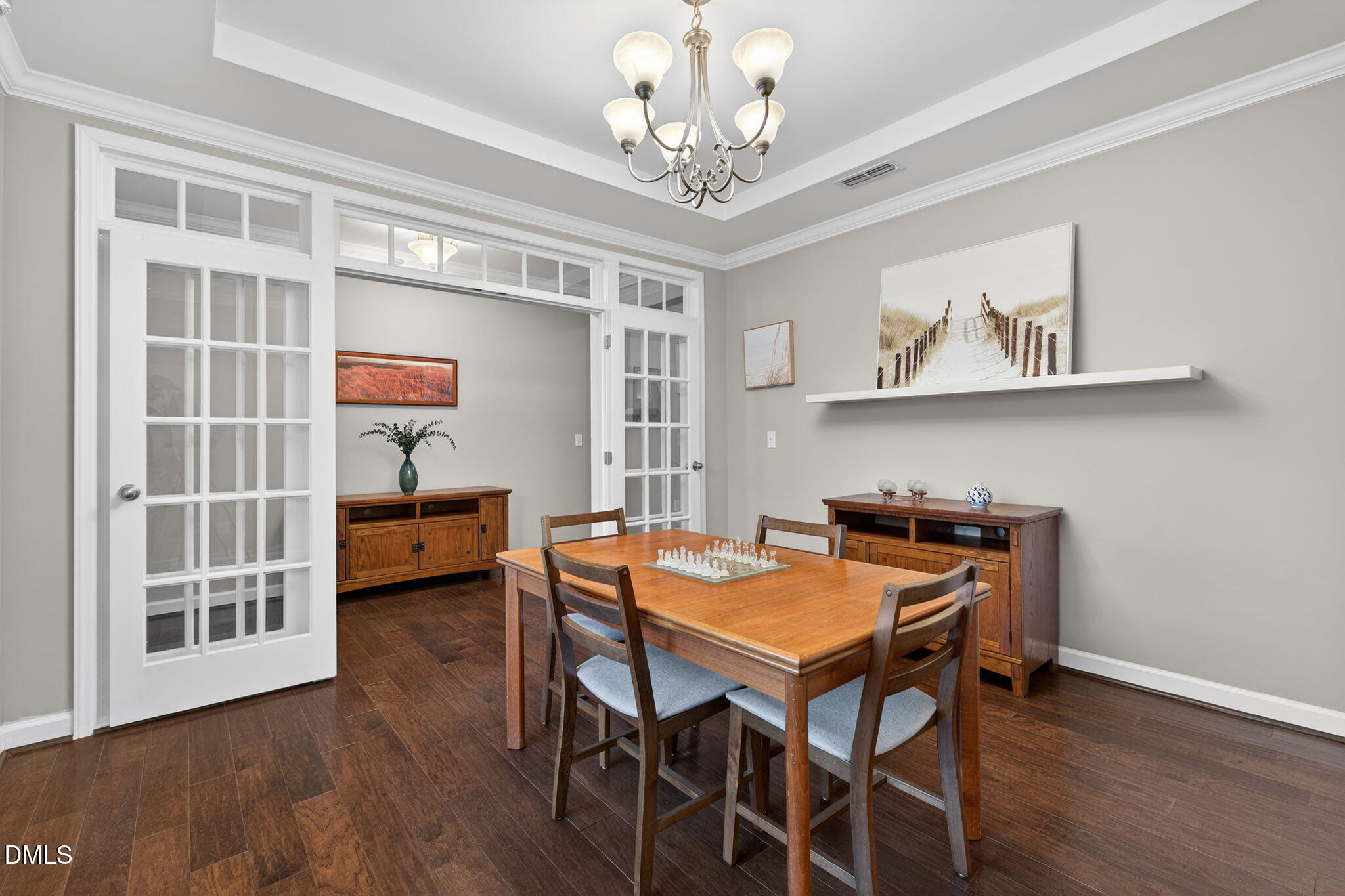 8001 Hergety Drive Raleigh, NC 27603 - Photo 15 of 52 a view of a dining room with furniture and wooden floor