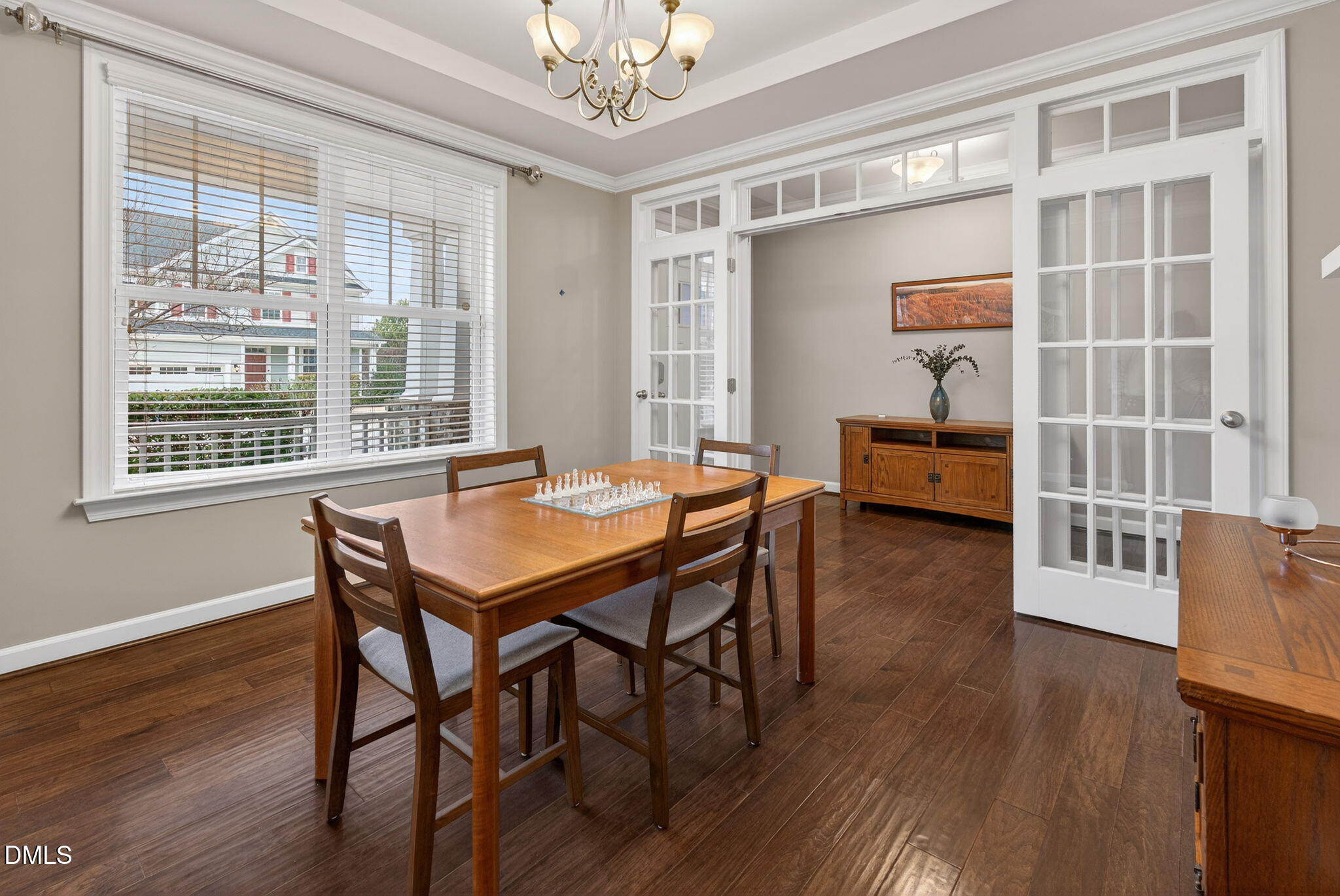 8001 Hergety Drive Raleigh, NC 27603 - Photo 16 of 52 a view of a dining room with furniture window and wooden floor
