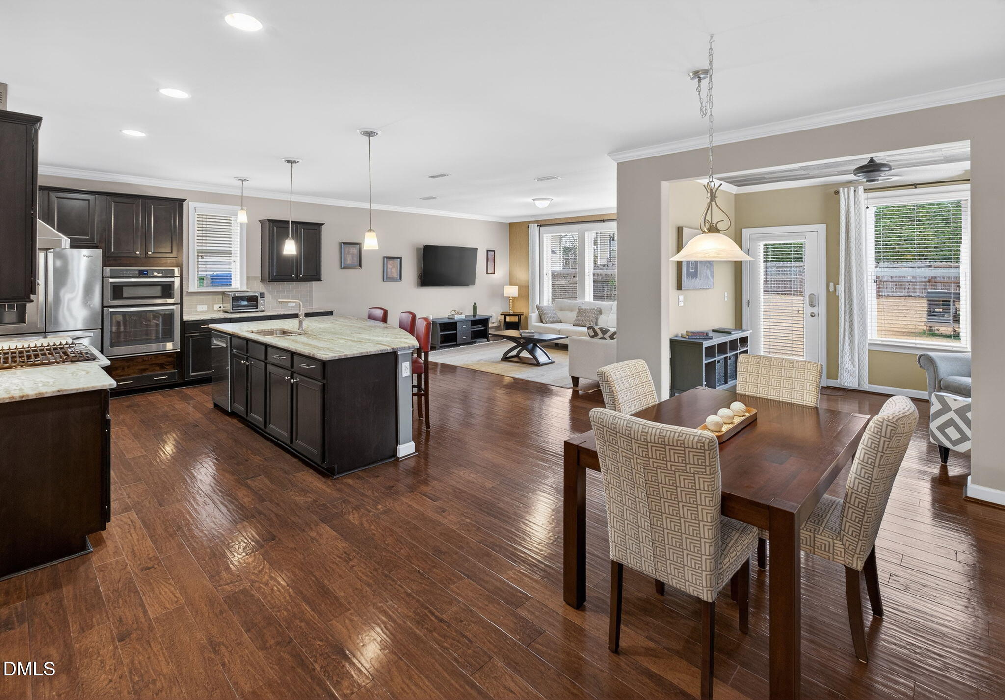 8001 Hergety Drive Raleigh, NC 27603 - Photo 17 of 52 a large kitchen with a table and chairs in it