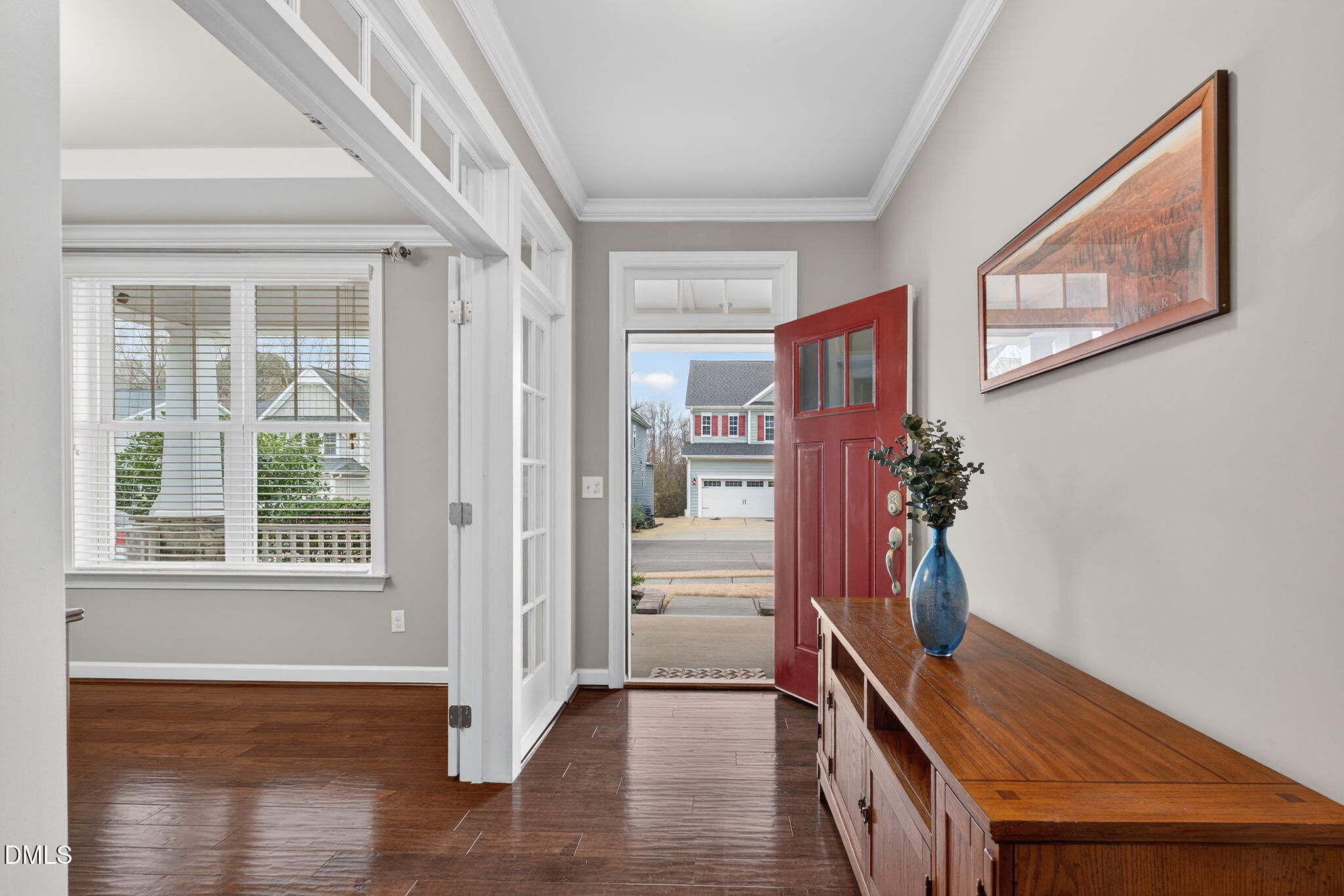 8001 Hergety Drive Raleigh, NC 27603 - Photo 2 of 52 a view of an entryway with wooden floor and a livingroom